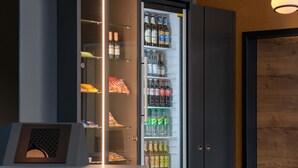 A minibar with various beverages and snacks. - Ibis Styles Coburg (Coburg)