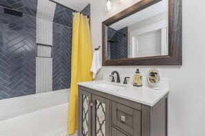 Combined shower/tub, hair dryer, towels, soap