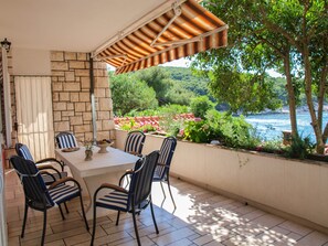 Apartment, Multiple Beds | Balcony - Beachfront Apartment With big Terrace and Garden (Postira)