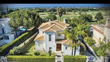 Enjoy a retreat with a swimming pool and lush garden surroundings.