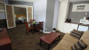 Deluxe Suite with Two Queen Beds | Living area | 32-inch LCD TV with cable channels