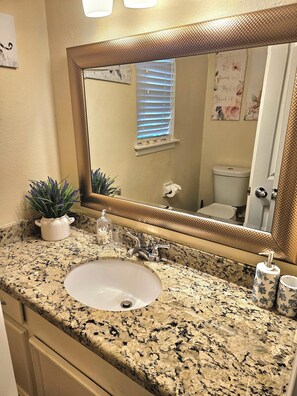 Combined shower/tub, hair dryer, towels, soap