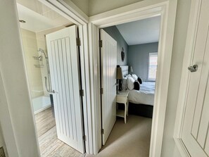 Combined shower/tub, hair dryer, towels, soap