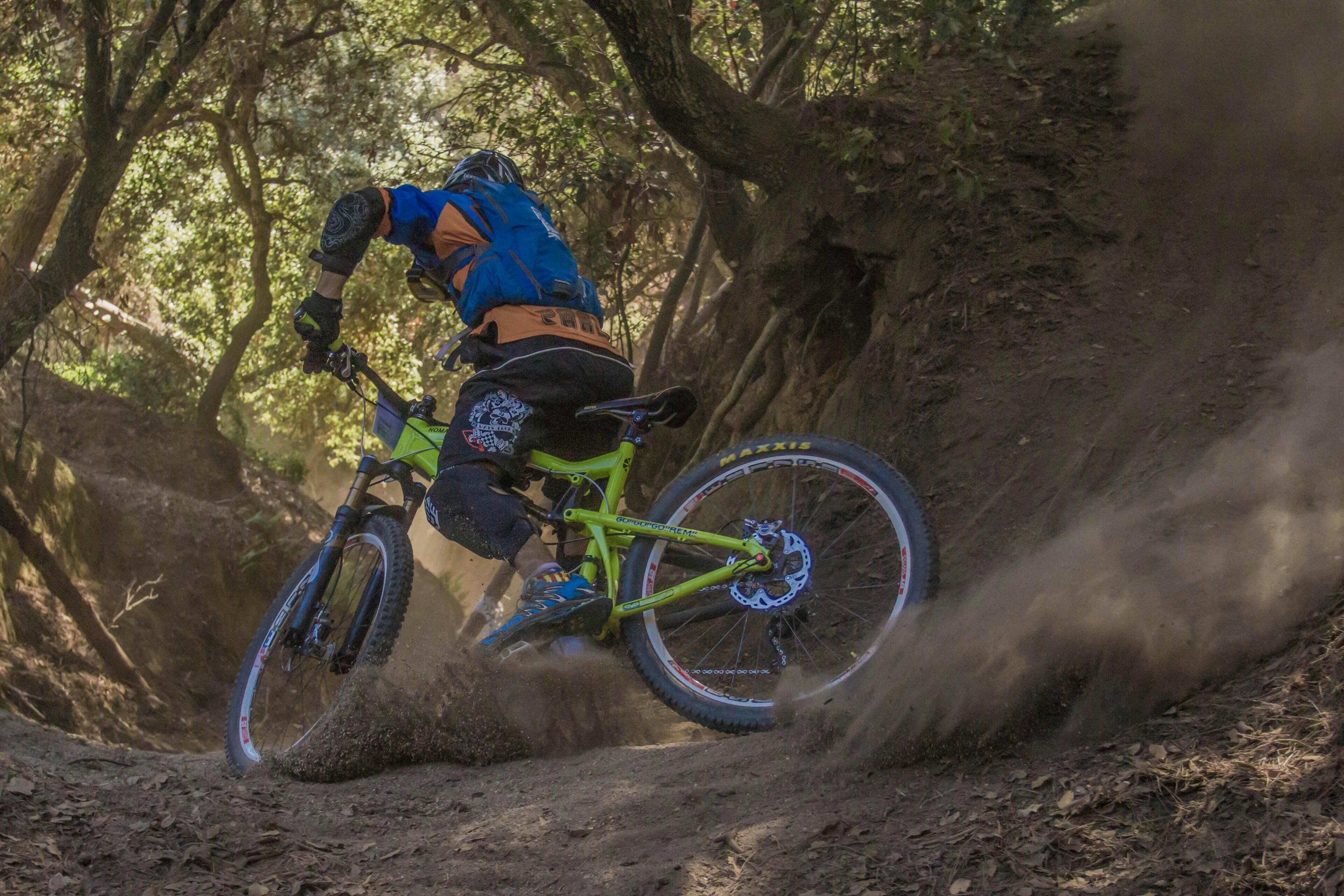 A mountain biker navigating a dirt trail.