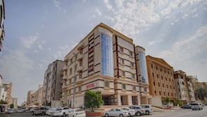 A multi-story hotel with a prominent "HOTEL" sign, featuring a modern architectural design with large windows and balconies. - Al Tamayoz Al Raqi Al Salamah (Jeddah)