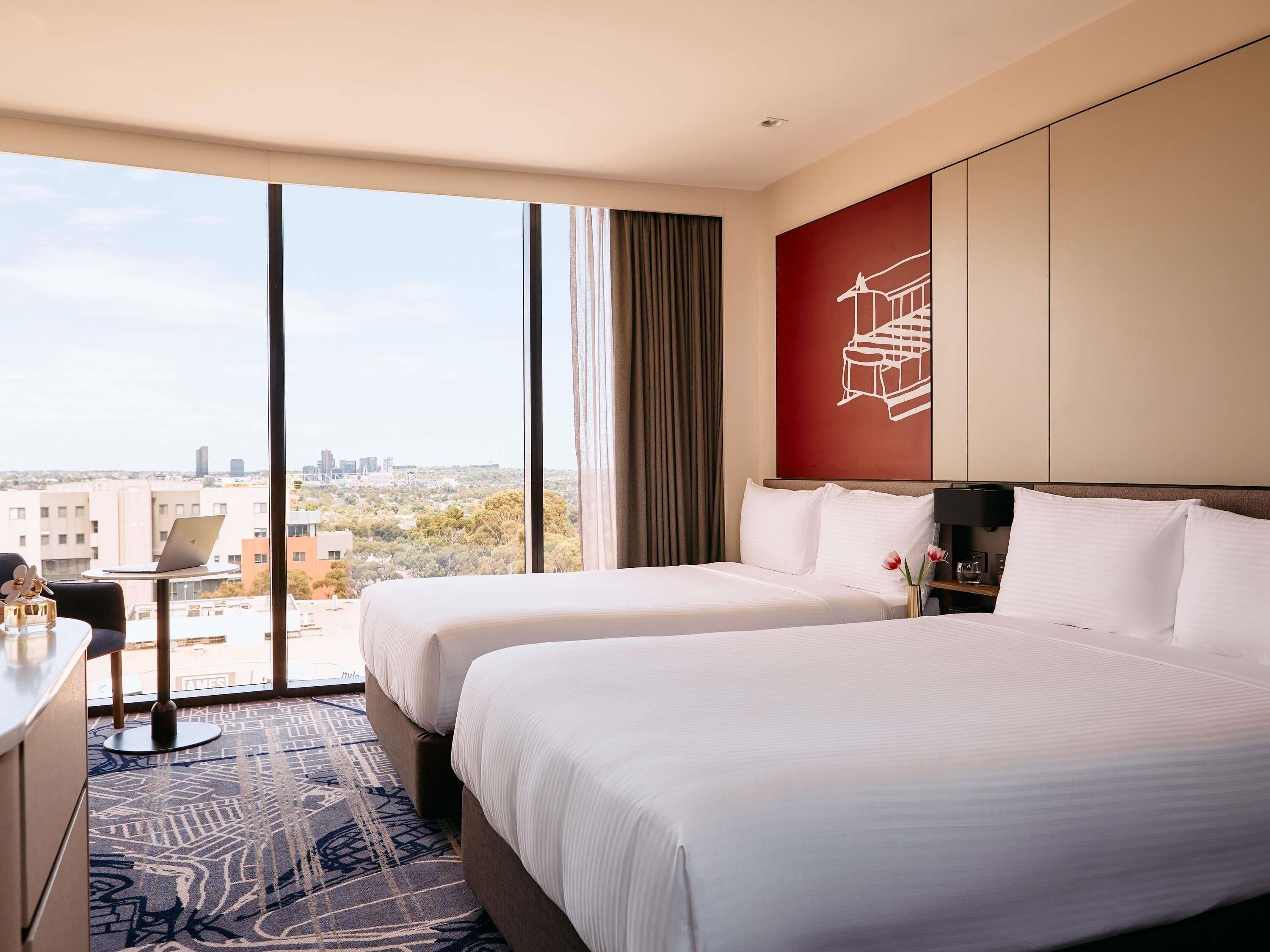 Premium bedding, pillow-top beds, desk, laptop workspace