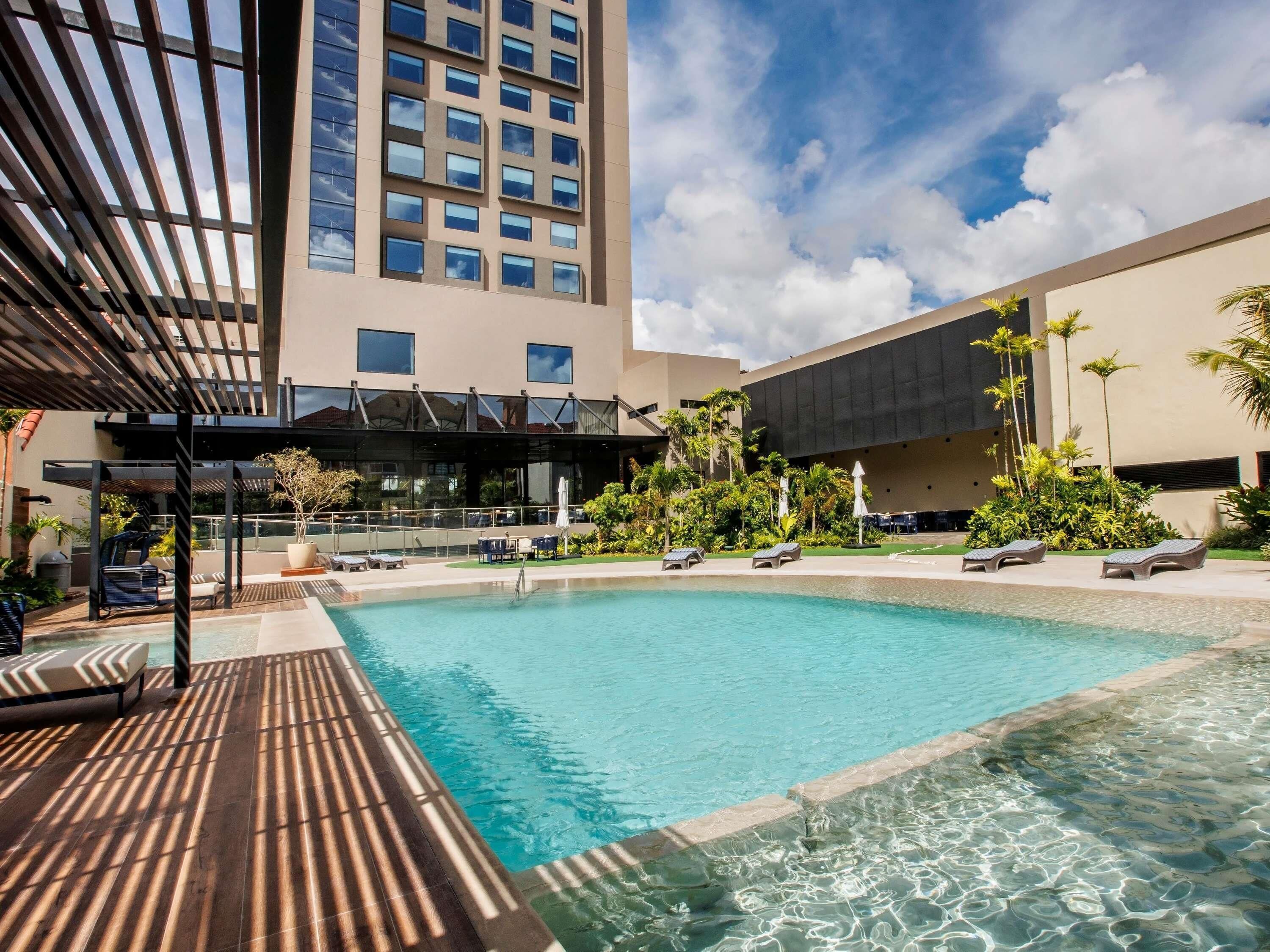 Outdoor pool, open 8:00 AM to 11:00 PM, free pool cabanas