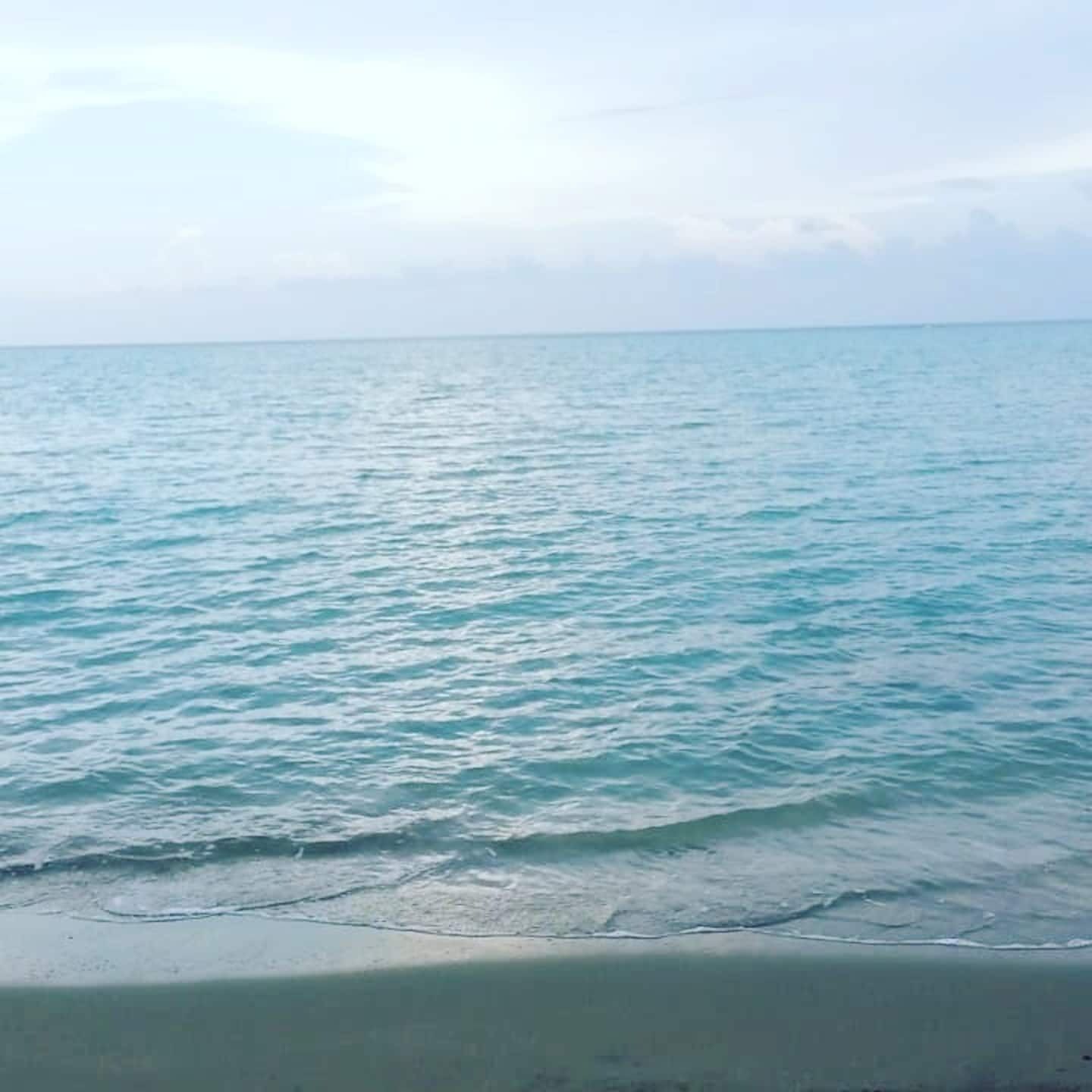 On the beach, black sand