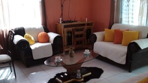 Family House | Living area | Flat-screen TV - Cockle Stop Inn Beach Holidays (Black River)