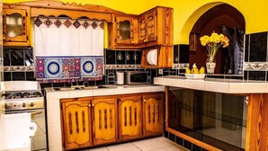 Family House | Private kitchen | Fridge, microwave, cookware/dishes/utensils, dining table - Cockle Stop Inn Beach Holidays (Black River)