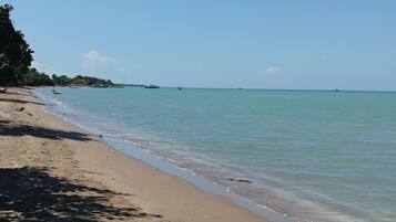 On the beach, black sand