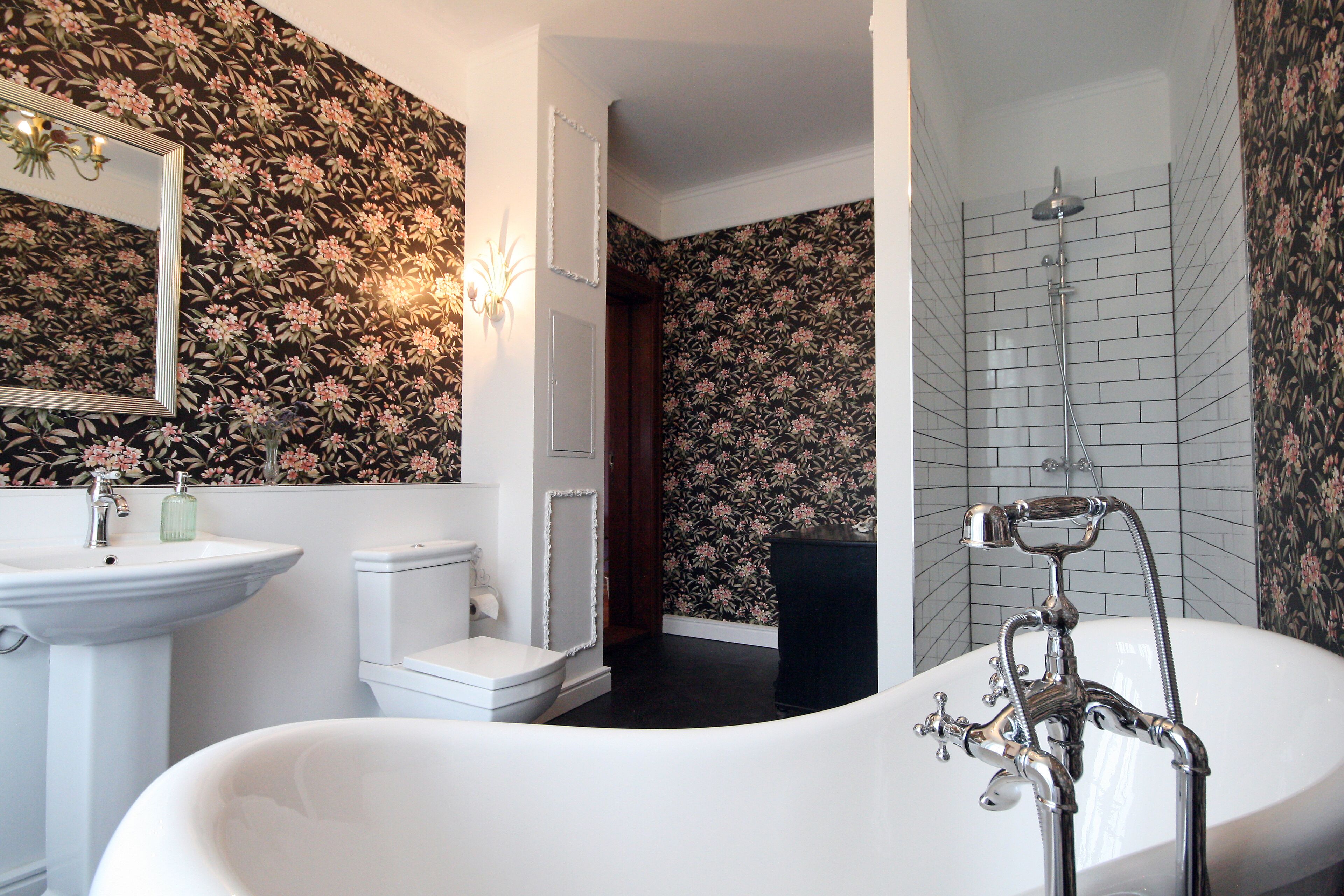 Bathtub, hair dryer, towels, toilet paper