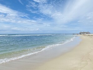 On the beach, sun-loungers, beach towels