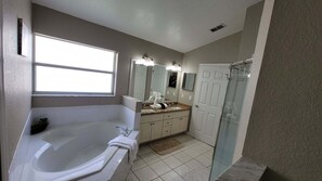 Combined shower/tub, hair dryer, towels, soap