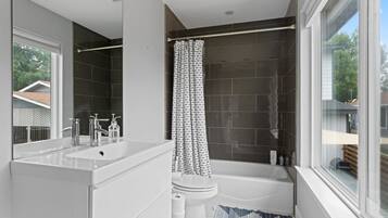Combined shower/tub, hair dryer, towels, soap