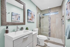 Shower, hair dryer, towels, shampoo