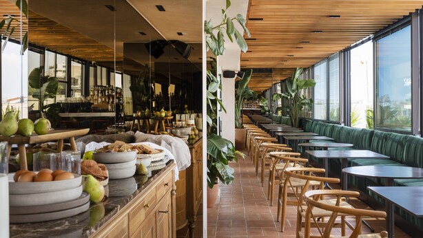 A restaurant with a long counter, wooden chairs, and green cushioned seating. - L'Avventura Athens (Athens)