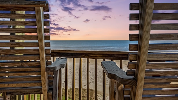 A wooden deck with a view of the beach and ocean. - Beachfront | Expansive Deck, Grill & Ocean Views (Gilchrist)