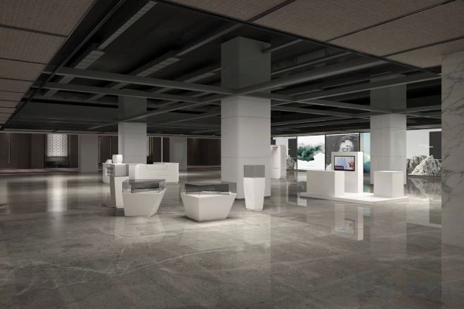 A spacious indoor area with high ceilings and a polished floor, featuring several white seating areas and a reception desk.