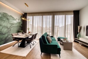 Exclusive Apartment, 2 Bedrooms, Pool Access, Garden View | Living area | 80-cm Smart TV with satellite channels, TV