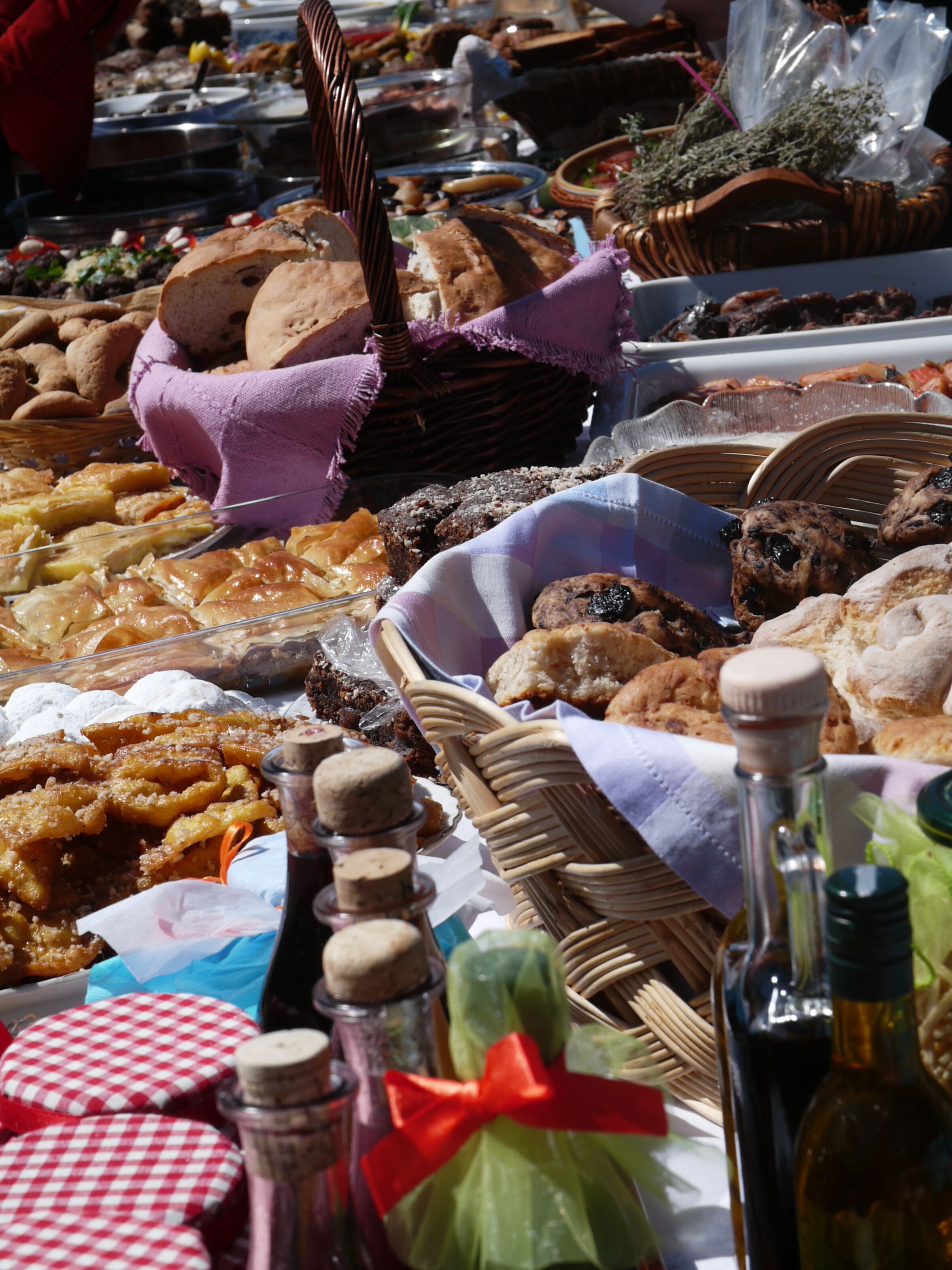 A variety of baked goods and condiments displayed on a table.