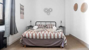 1 bedroom, desk, iron/ironing board, travel crib
