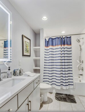 Combined shower/tub, hair dryer, towels, shampoo