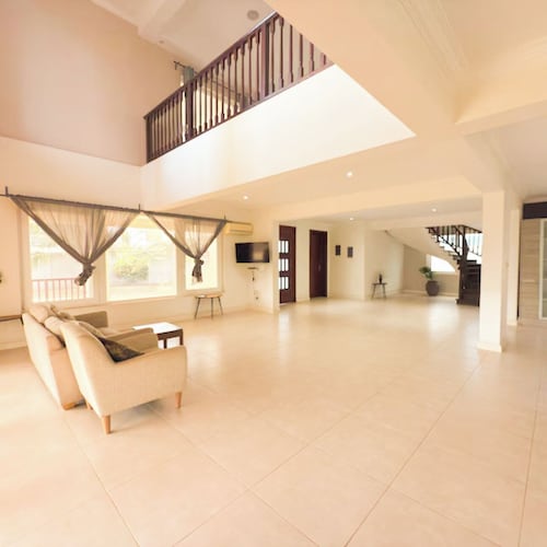 A peaceful family home with brilliant sea views, set within private grounds.