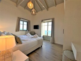 Shower, designer toiletries, hair dryer, bathrobes