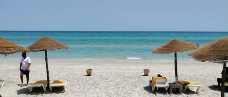 On the beach, white sand, 2 beach bars