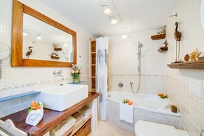 Bathtub, hair dryer, towels