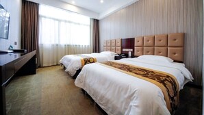 A hotel room with two beds, a desk, and a large window. - Ji Bin Hotel (Changsha)