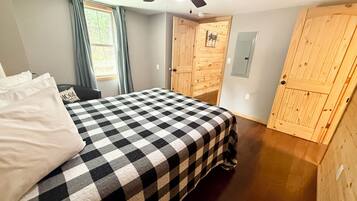 1 bedroom, desk, iron/ironing board, travel crib