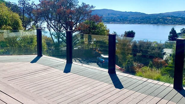 A wooden deck with a clear view of a lake and distant hills. - Take in the San Francisco views at this quiet oasis! (Tiburon)
