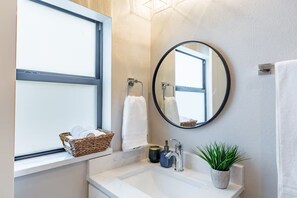 Combined shower/tub, hair dryer, towels, soap
