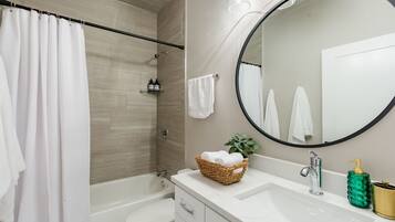 Combined shower/tub, hair dryer, towels, soap