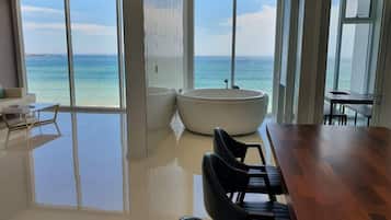 Family, Spa Tub (Contact Hotel for Pet Surcharge) | Living area | Flat-screen TV