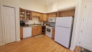 A kitchen with wooden cabinets, a white refrigerator, a microwave, a dishwasher, and a stove. - Beautiful 2Bed,2Bath,2Car Garage Stunning Cul-de-sac property on 2 acres Estate (Spring Hill)
