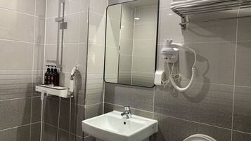 Triple Room | Bathroom | Shower, hair dryer, slippers, towels