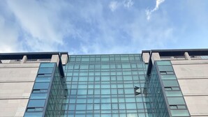 The Jeju Grace Hotel facade with a modern glass design and a prominent entrance. - Jeju Grace Hotel (Seogwipo)