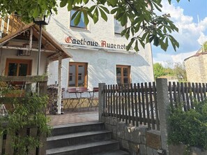 A traditional building with a sign reading "Gasthof Ruagenstam".