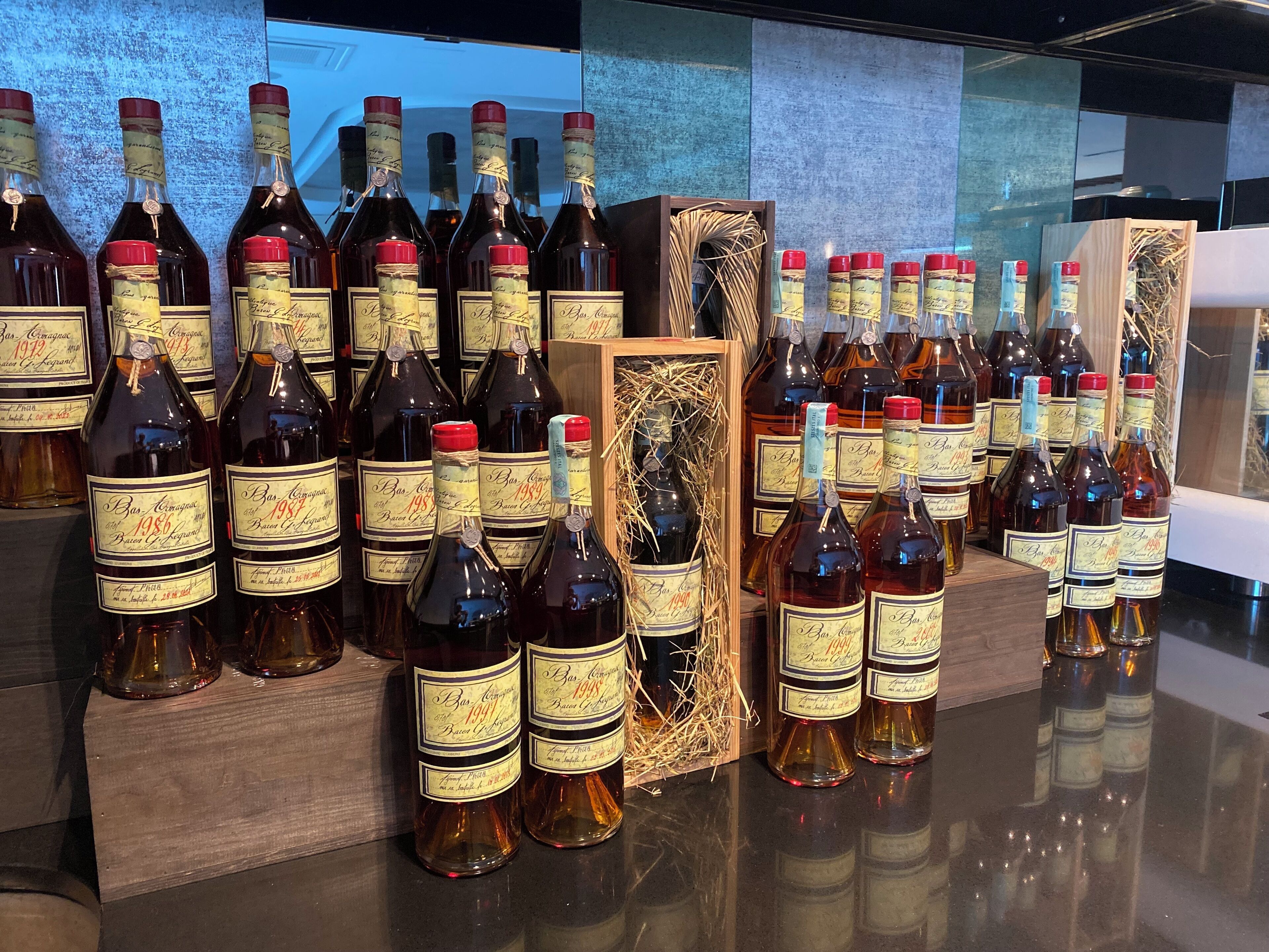 A display of wine bottles with labels indicating they are from 1986 and 1987.