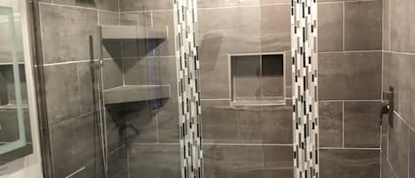 Bathtub, hair dryer, towels, soap