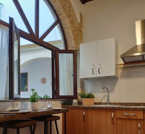 Fridge, microwave, stovetop, coffee/tea maker