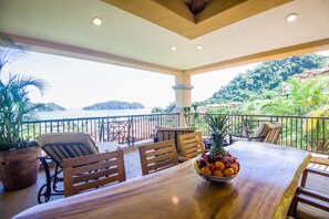 Outdoor dining - Ocean View Luxury Condo next to pool + access to all amenities. (Herradura)