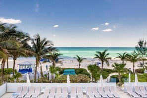 On the beach, sun-loungers, beach towels