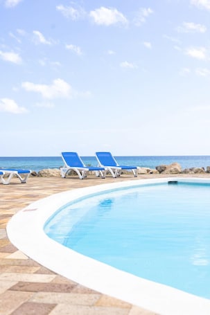 Outdoor pool, open 7:30 AM to 8:00 PM, sun loungers. OceanBlue