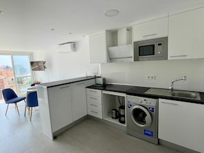 Fridge, microwave, stovetop, coffee/tea maker
