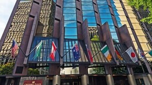 A tall, modern hotel with a glass facade and a distinctive architectural design. - 2 Connecting Suites at a 4⭐️ Hotel (Seattle)