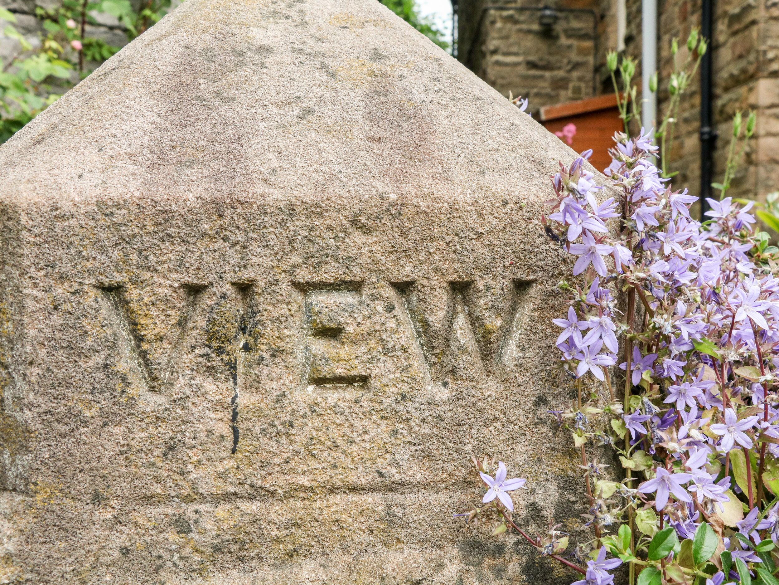 A stone monument with the word "VIEW" carved into it.